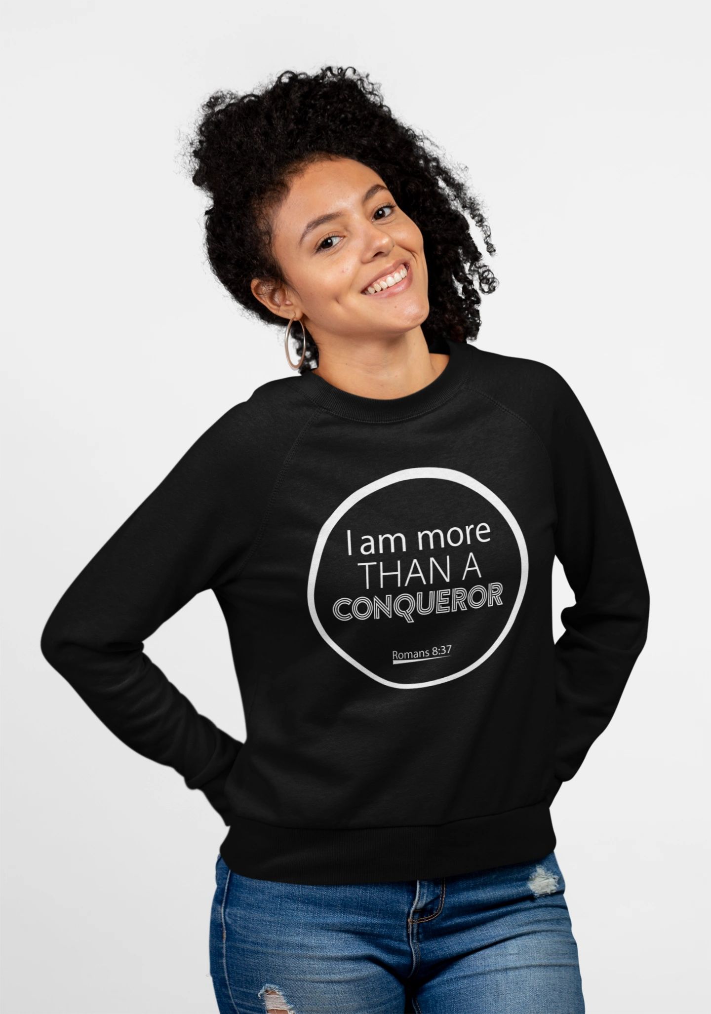 Woman wearing faith sweatshirt — I Am More Than a Conqueror